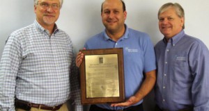 Tom Johnson, President; Jeffrey Lewis, VP of Operations; and Thomas Gaseor, Quality Manager with the ISO 90012008 certification plaque for BMT Scientific Marine Services.