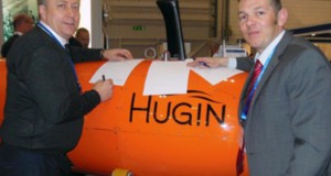 Kongsberg's Helge Uhlen and Andy Hoggarth from CARIS sign MOU at oceanology international