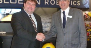 Omer Poroy (Bluefin Robotics) and Nick Swift (Sonardyne) on stand with Bluefin Robotics' AUV at Oceanology International.