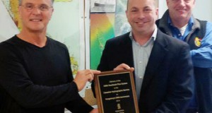 Kongsberg Maritime Subsea Sales Manger in Canada, Nick Burchill presented a plaque to Denis D'Amours