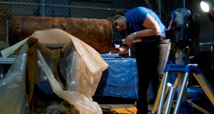 Caitlin Swec, a project engineer at Naval Surface Warfare Center Carderock Division, makes a 3-dimensional scan of the number 24 Howell Torpedo at the Underwater Archeology Branch (UAB) of the Naval History and Heritage Command (NHHC) on the Washington Navy Yard. Lost from the Iowa (BB 4) during a training mission and found by a dolphin in the U.S. Navy Marine Mammal Program off the coast of San Diego last year, UAB has been desalinating the torpedo since May 2013. (U.S. Navy photo by Mass Communication Specialist 2nd Class Eric Lockwood