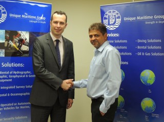 Martin Somerville from BWE Shaking Hands with Harry Gandhi , CEO of UMG on this new partnership (left to right)