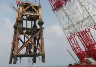 Jinzhou 20-2SW platform jacket is lifted off water.