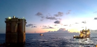 Red Hawk spar being towed to reefing site